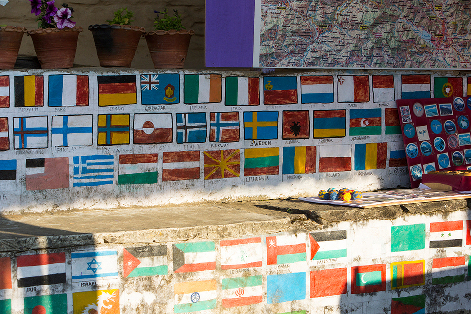 Different countries flags painted on a path side shop on the Annapurna Base Camp trek, Himalayas, Nepal. 